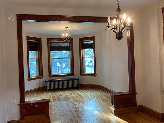 Dining room, looking into living room, located at the front of the unit.