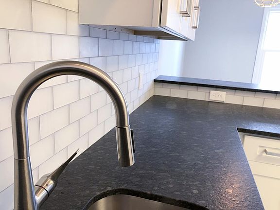 New Sink, Counter, Glass Tiles, and Cabinets