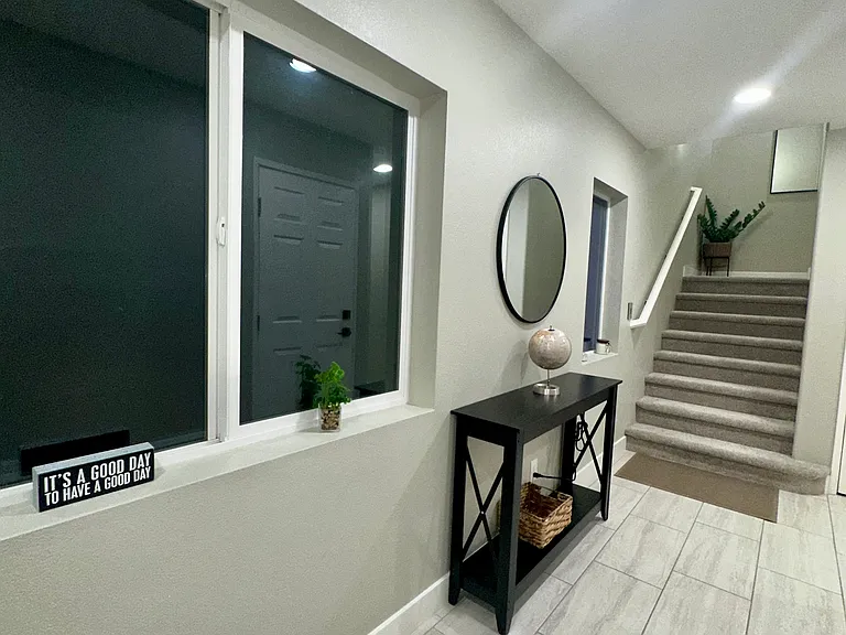 Welcoming Foyer with Staircase Leading to Upper Levels
