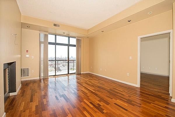 Living Room w/fireplace and balcony