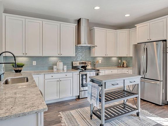 Gleaming brand new kitchen with granite countertops, solid hardwod cabinets and brand new Stainless Steel Appliances!