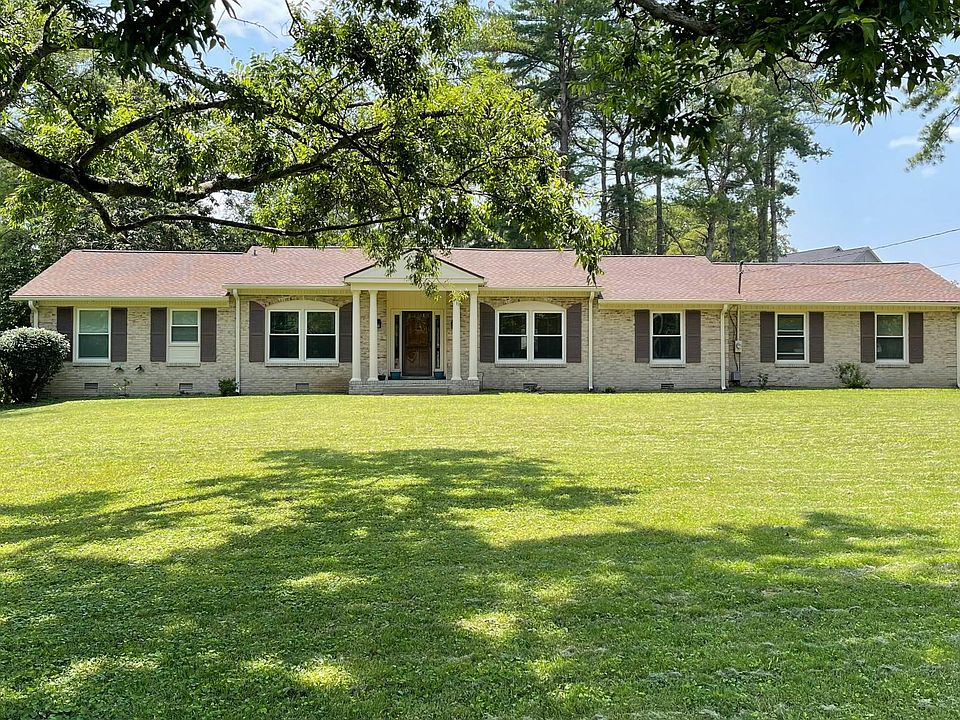 3 BR, 2 Bath brick ranch with cathedral ceiling on one acre lot.