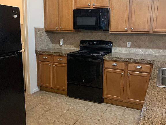 New black appliances include: refrigerator, stove/oven, microwave, dishwasher