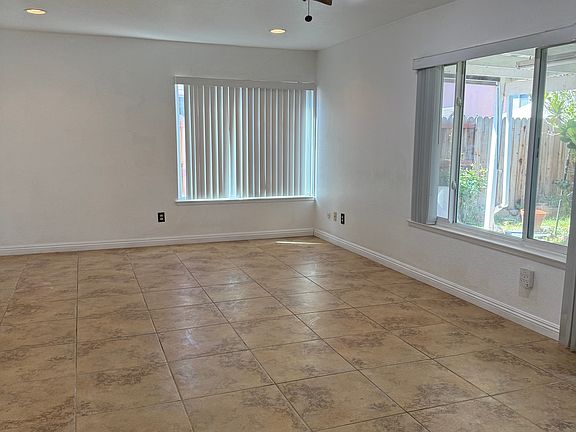 Large family room and cover patio at back of the house for shade & entertaining