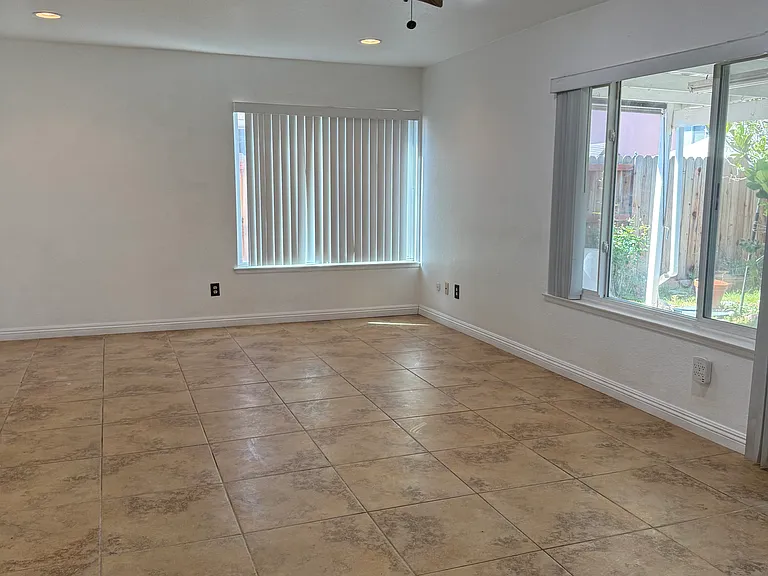 Large family room and cover patio at back of the house for shade & entertaining