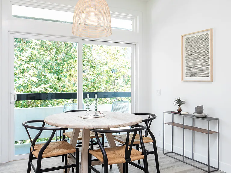Dining room next to sliding doors to private balcony
