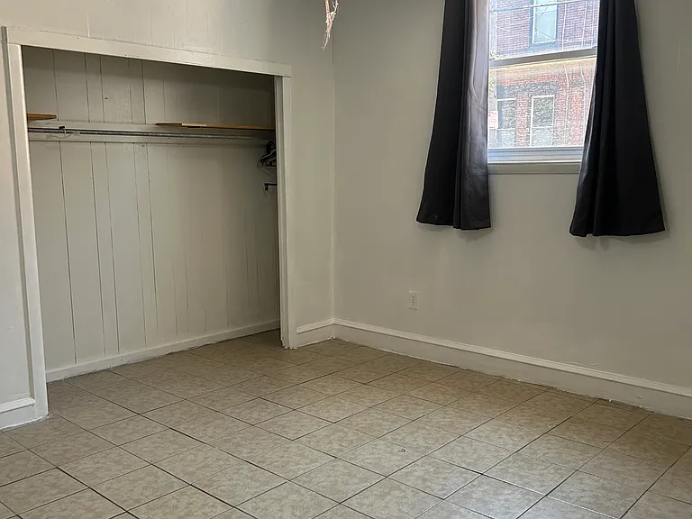 Primary bedroom with closet and ceiling fan