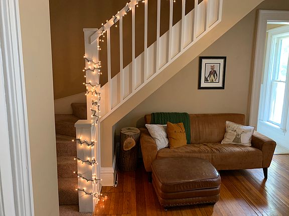 Family room showing stairwell to the second floor.