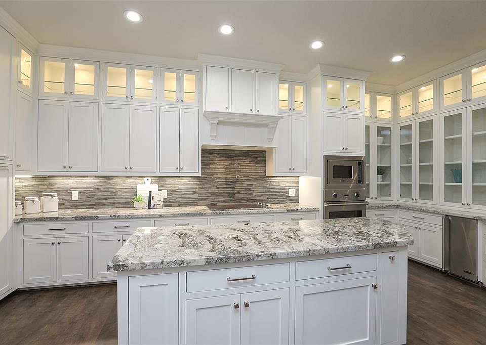 Full remodel of this open floor plan patio home. The kitchen was taken down to the studs with every detail improved! Flooring, on site built cabinetry with soft closing drawers and cabinets, glass display fronts, under cabinet lighting just to name a