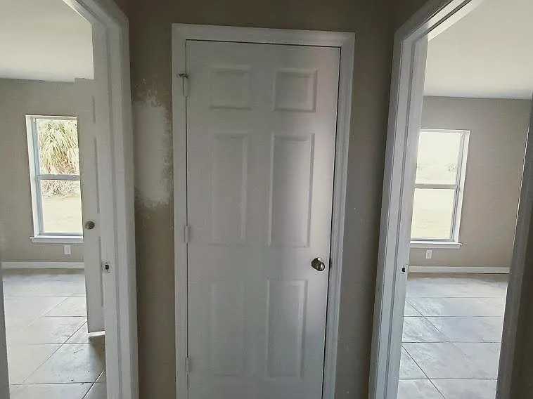 hallway closet in hallway between 2 guest bedrooms