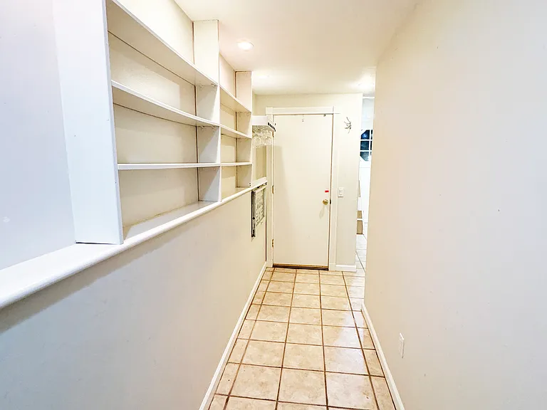 Garden level second master suite hallway. Private entry, kitchenette and full bathroom. Can be used as office, guest bedroom, yoga studio, etc.
