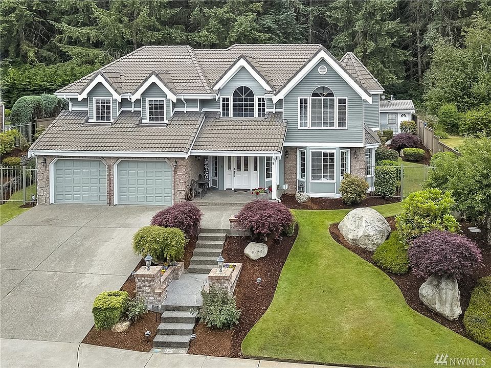 The Crown of Cormorant Passage!  Impeccably maintained custom home on manicured grounds.  50-year Tile roof.