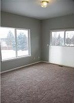 family room wrapped with windows