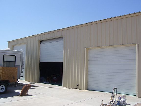 Huge shop! 40x80 with large 3 auto roll up doors with 16' ceiling.