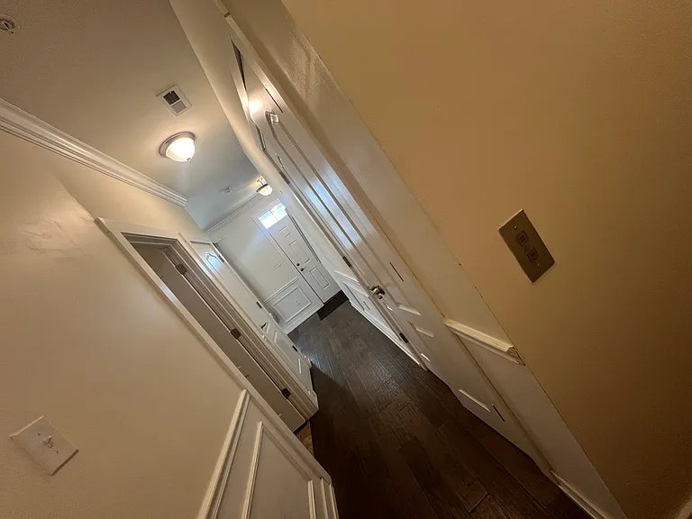 1st fl hallway to laundry, garage and elevaltor