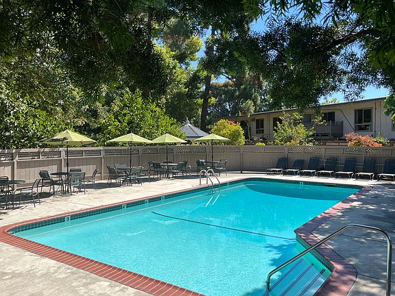 Pool available for year-round use. Solar-heated in summer. Some shade and some full sun options around the large pool deck.