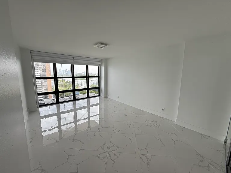MASTER BEDROOM with dimmable designer lighting, full wall mirror, floor-to-ceiling impact windows, electric blackout curtain, zebra shades, brand new walk-in closet & a second large closet