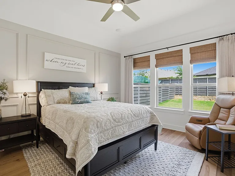 Large primary bedroom can accommodate all bedroom suite sizes + room for a sitting area. LOVE the picture frame wall accent wall too.