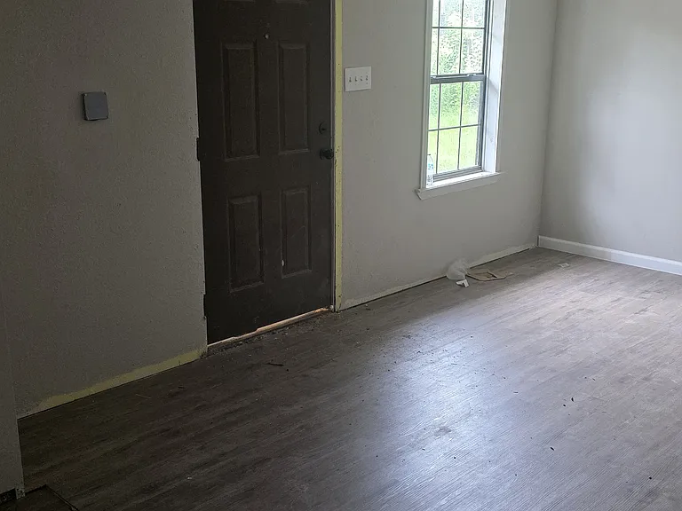 Extended main living area has additional exterior access door.