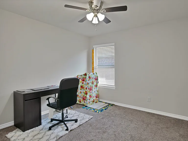 Bedroom #4 with a ceiling fan