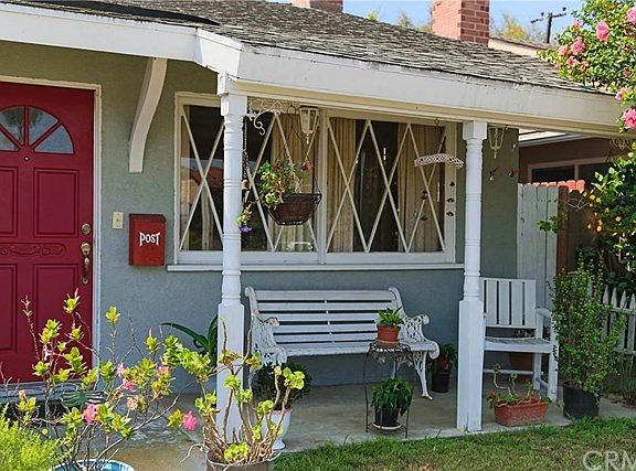 Front yard porch with red door accent
