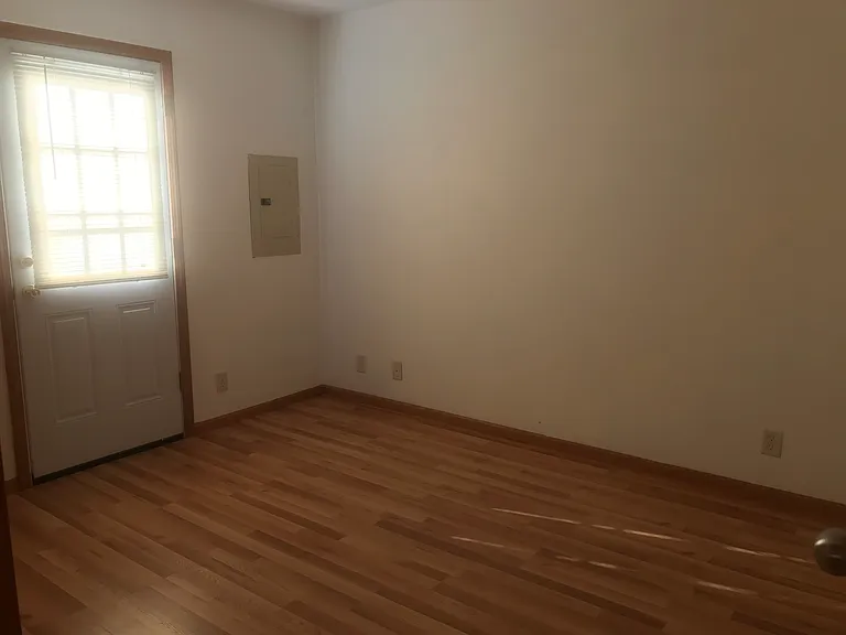 2nd Bedroom has a door that leads to the back yard.