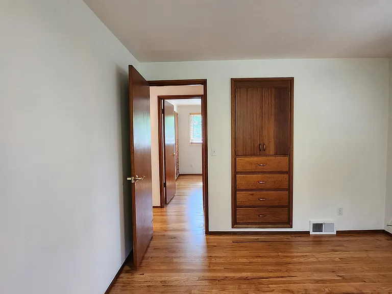 Another view of Bedroom 2 with primary suite across the hall.