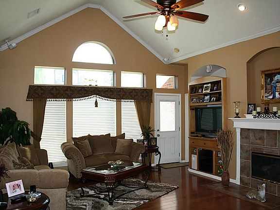 Family Rom with Beautiful Crown Molding and windows to let natural sunlight come in
