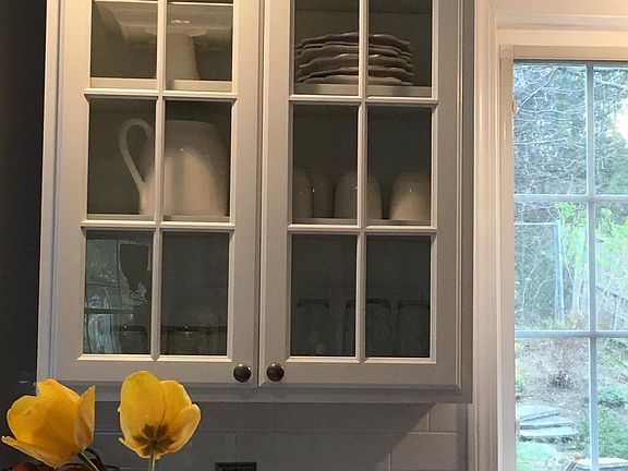 Fresh and clean white kitchen with lots of storage and light.