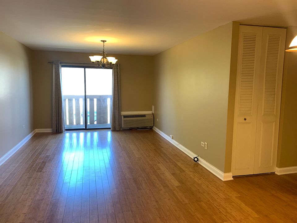 Walk in to an open layout of the living room and dining room.