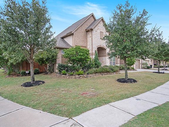 Located on corner lot with beautiful oak trees.