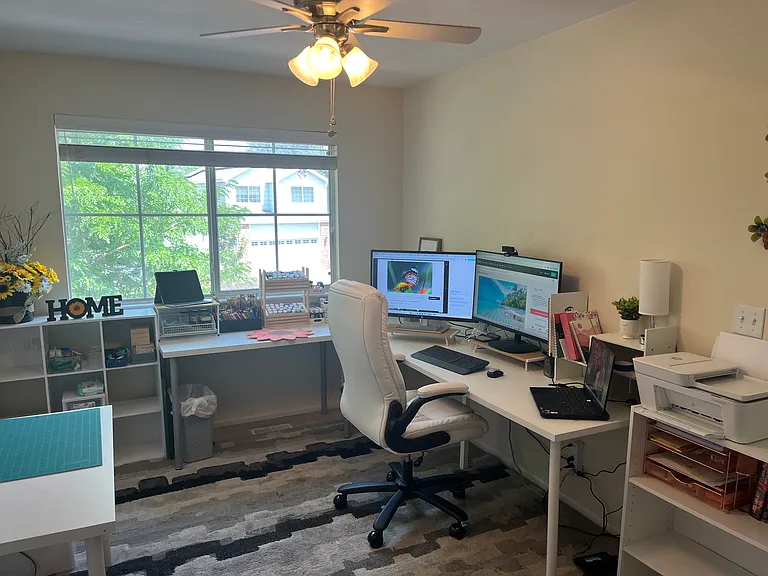 Upstairs, the third bedroom is currently used as an office and craft room. It is a large room
