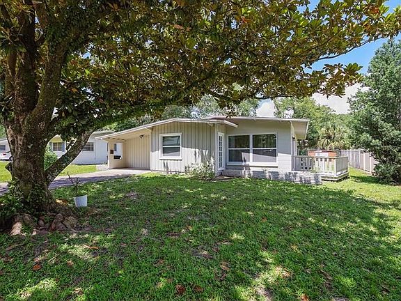 Front and side yard with deck