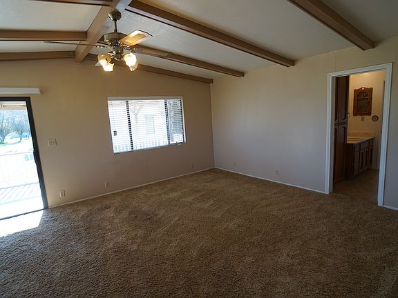 Family Room with Sliding Glass Door leading to Covered Deck