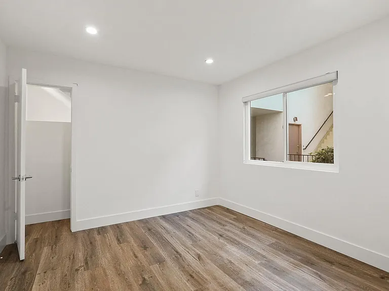 Bedroom with Vinyl Flooring and Window