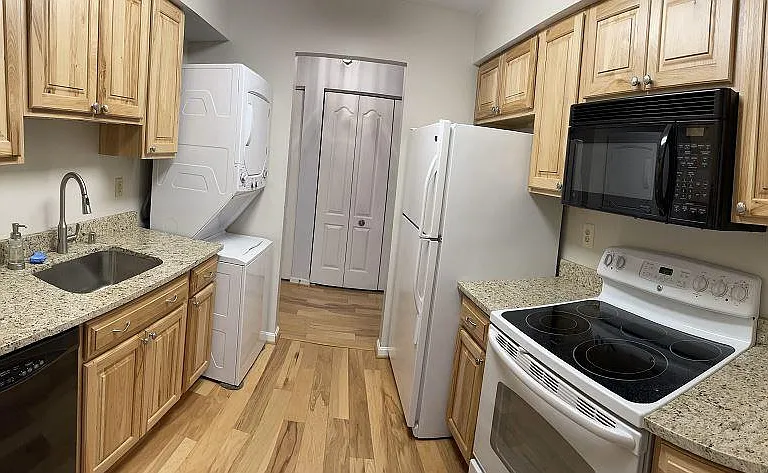 Fully updated kitchen with granite counters and new hardwood flooring