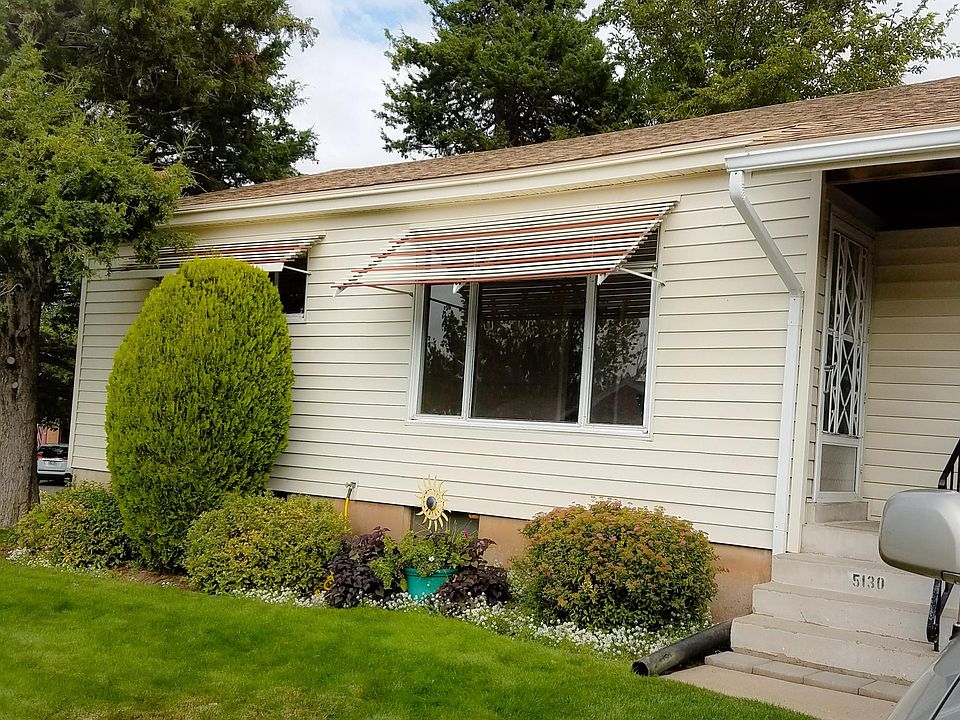 Front of House - Has 2-car carport to the left and separate entrance to the basement unit
