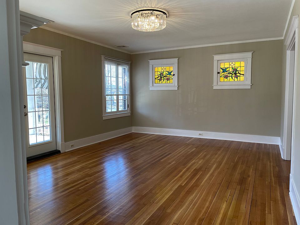 Entry into Living Room from front stairwell. Balcony French Doors to the left