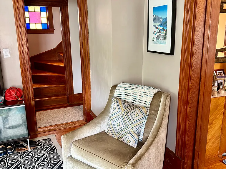 Living room looking towards stairs to third floor.