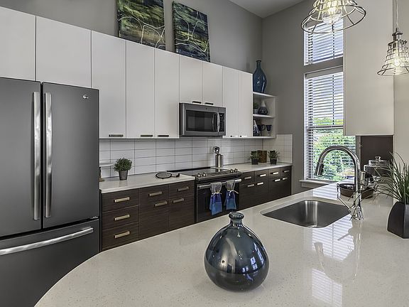 Quartz countertops with deep undermont stainless sinks