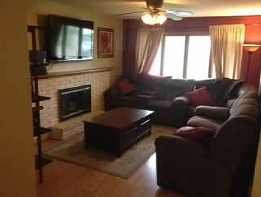 main level living room with fireplace