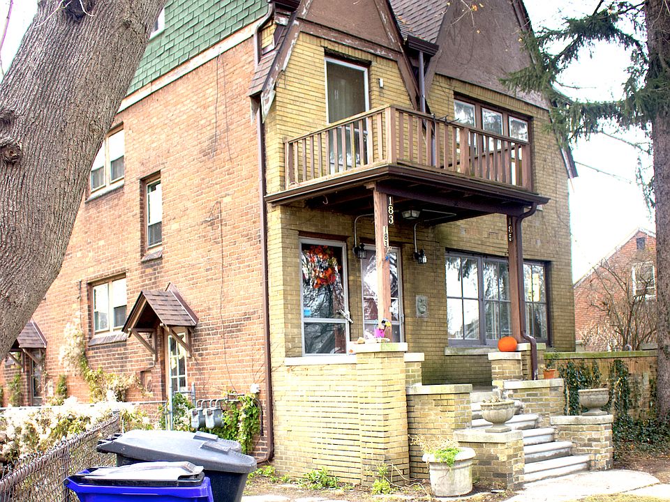 Side of the duplex with view of side entrance point/driveway