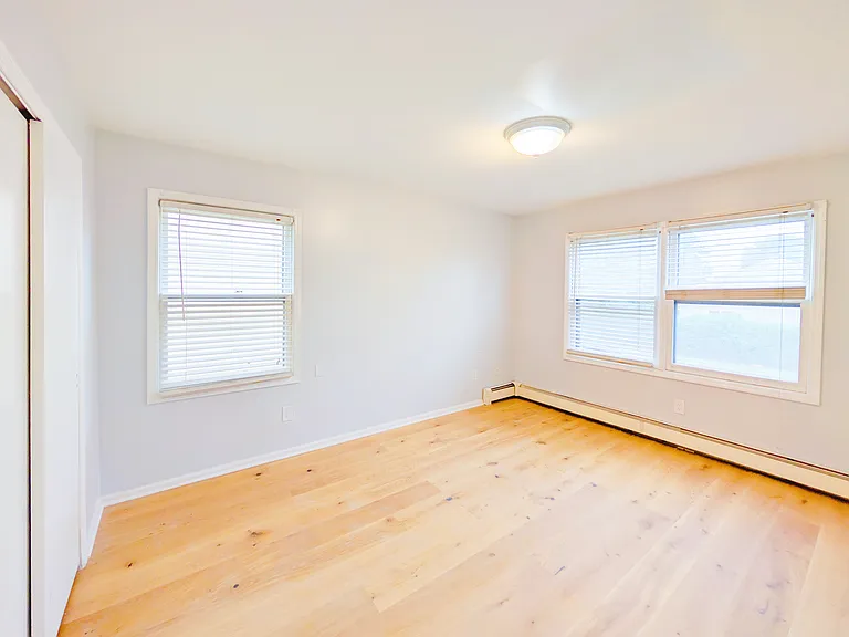 Secondary bedroom 1 with new wood floor and new ceiling light