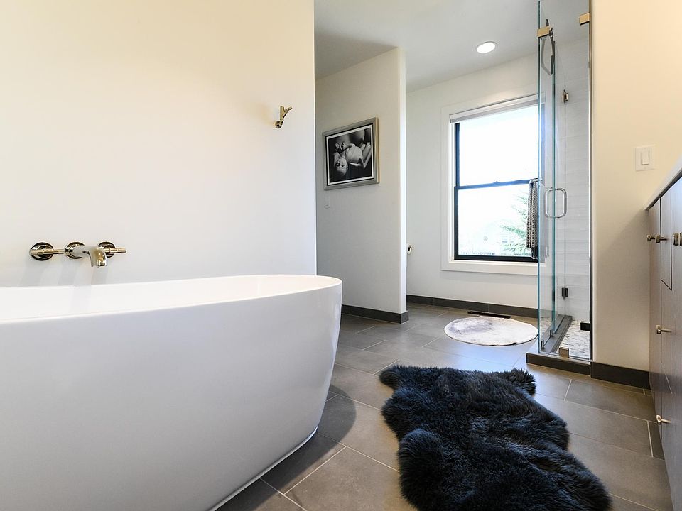 Stylish upstairs master bathroom with freestanding tub, big shower and two sinks
