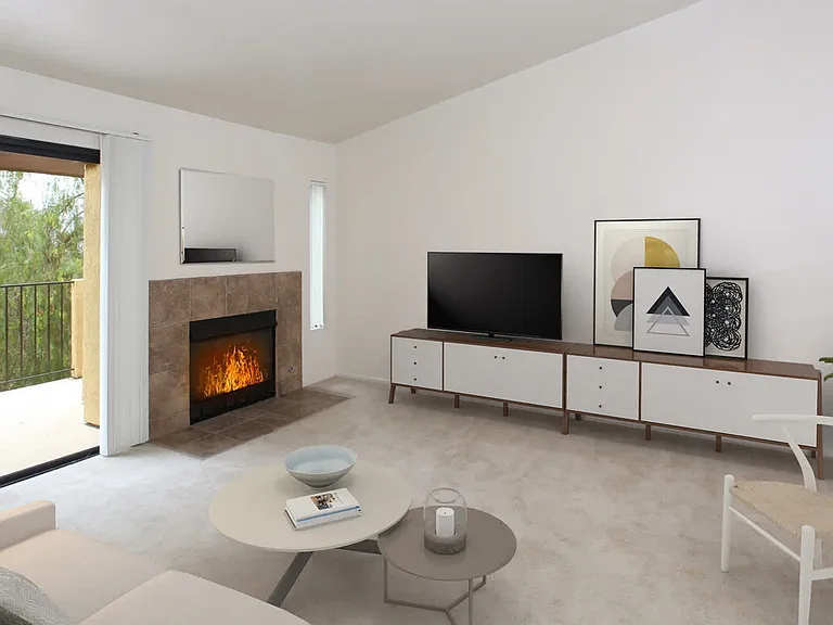 Carpeted Living Room with Fireplace and Balcony