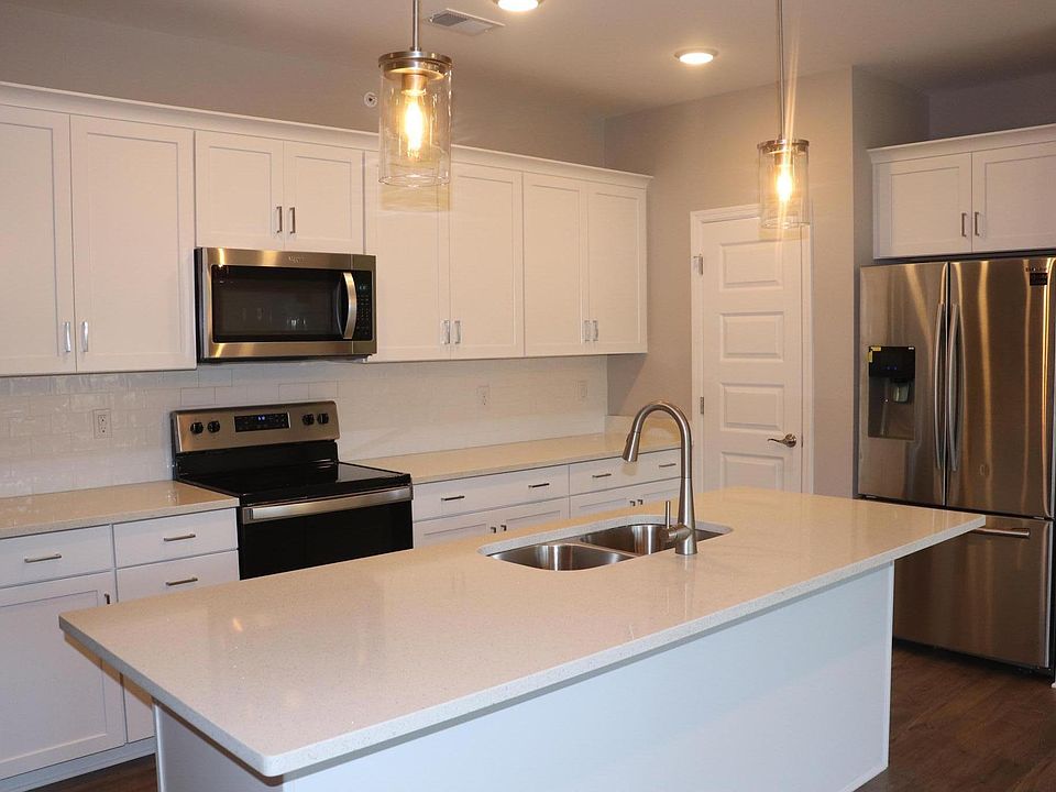Bright White Kitchen, Mirror Glass Quartz Countertops, Subway Tile, Dual Trash Cabinet Pull-out, and New Upgraded Appliances