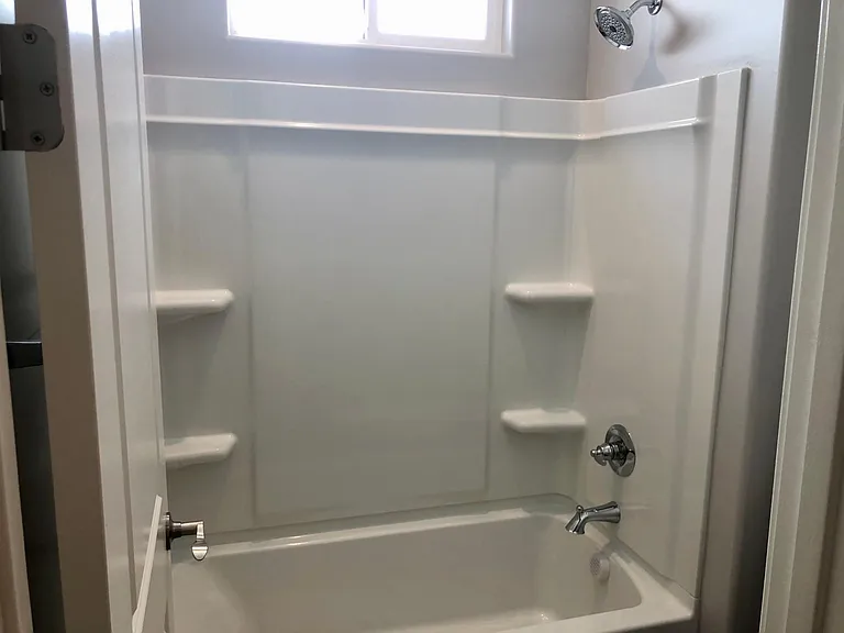 Upstairs guest bathroom with shower/tub