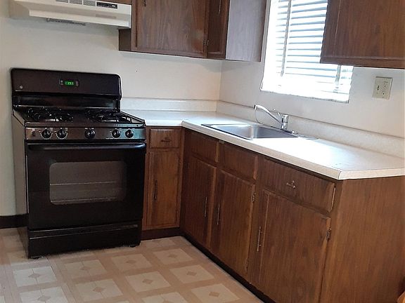 Sunny kitchen includes full size range and new 22.2 cubic foot refrigerator