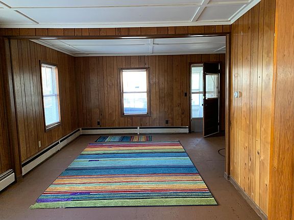 Large living room. Exit to shared sitting screened porch.