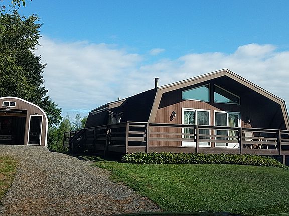 Front view with new shop driveway